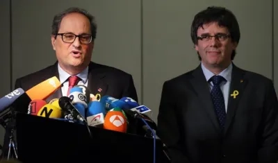 El presidente electo catalán, Joaquim Torra, y su antecesor, Carles Puigdemont.