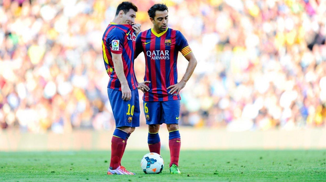 Lionel Messi y Xavi Hernández. 