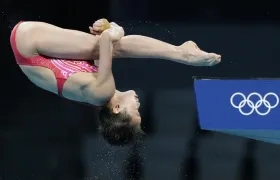 Hongchan Quan durante su salto perfecto. 