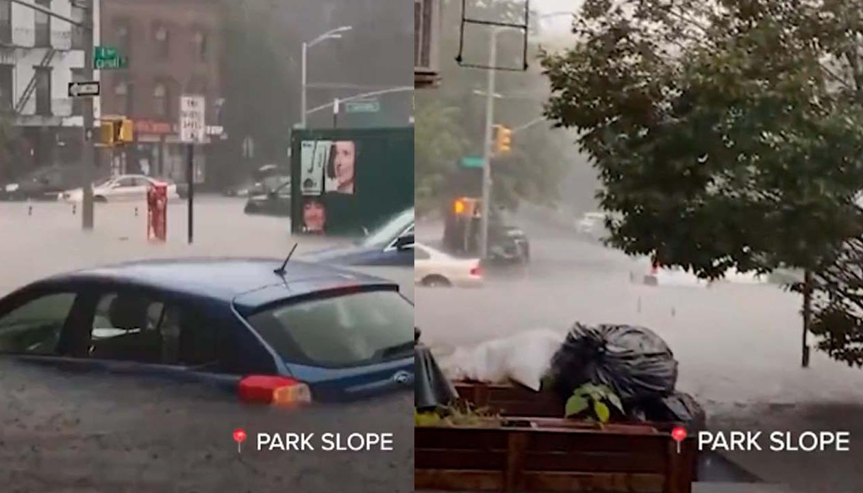 Vehículos a punto de ser tapados por las aguas en Nueva York en plena lluvia