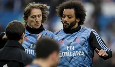 El croata Luka Modric y el brasileño Marcelo Vieira.